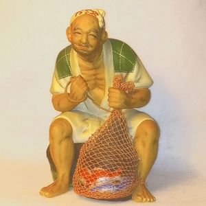 Vintage Japanese urasaki white clay sculpture of a fisherman